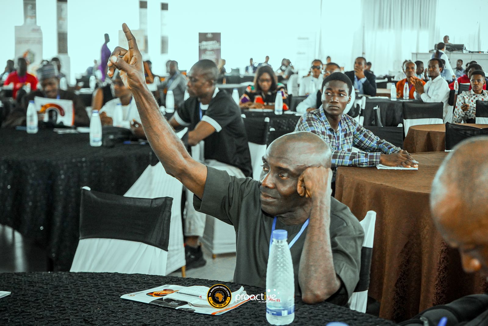 A packed session at a previous MRX Africa edition, with a delegate raising his hand to ask a question
