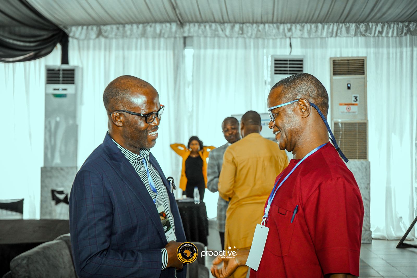 Two delegates talking during a break