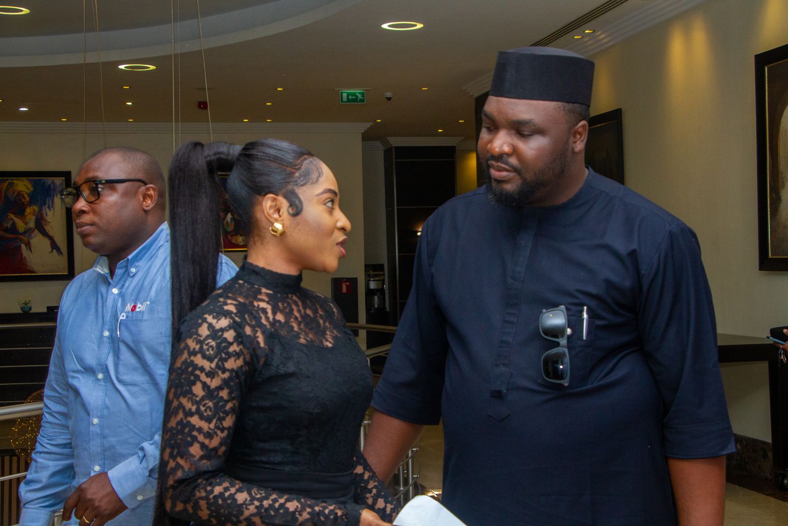 Delegates networking in a hotel lobby