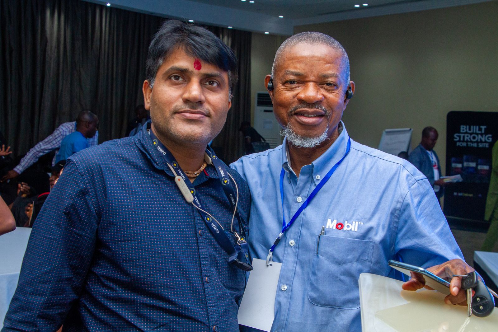 A partner representative with a delegate at a previous edition