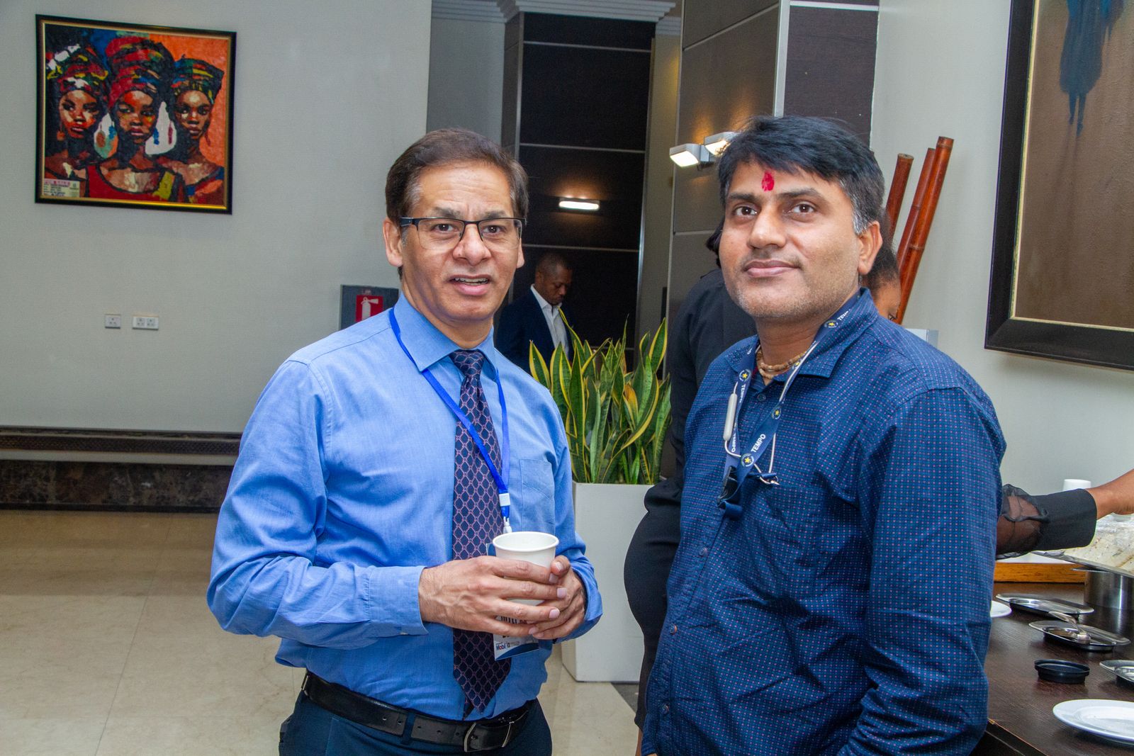 Two delegates talking at a reception
